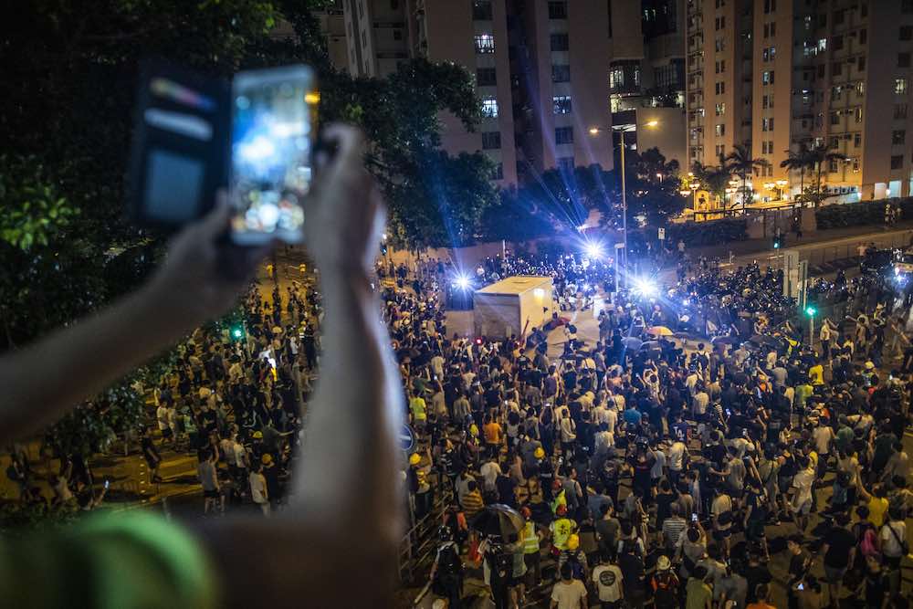 Recording demonstrators in Wong Tai Sin district, Hong Kong