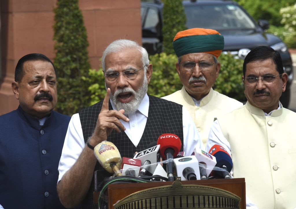 Indian Prime Minister Narendra Modi speaks to the press upon his arrival with other cabinet ministers to attend the opening day of monsoon session in parliament, 20 July 2023 (Imtiyaz Khan/Anadolu Agency via Getty Images)