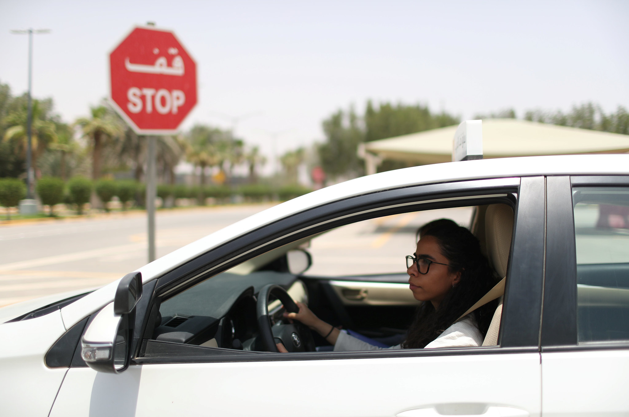 A woman taking a driving lesson in Saudi Arabia, June 2018