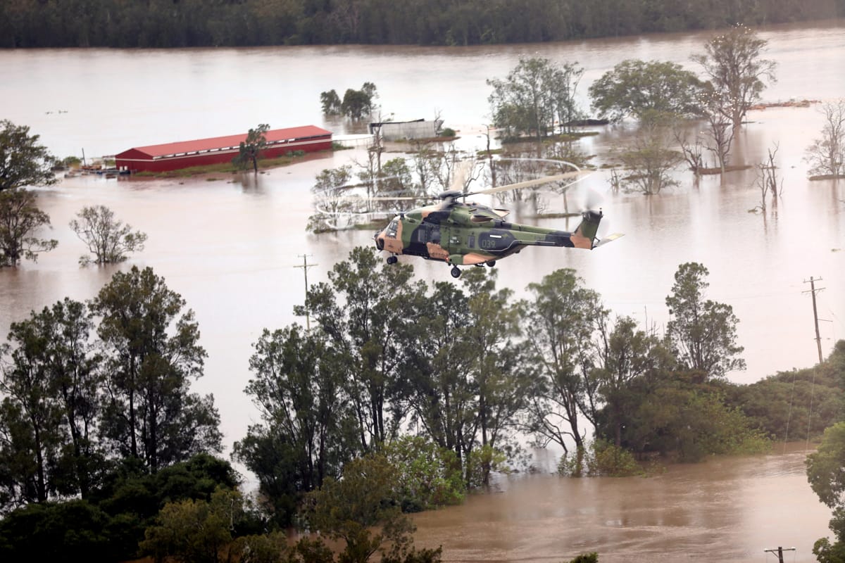 A military helicopter over flooded areas in Queensland, 2022 (C Barnett/Defence Department)