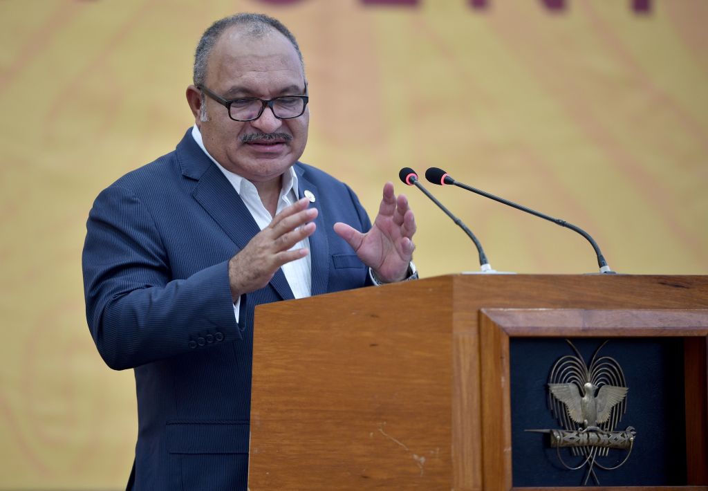 Peter O'Neill speaks at the closing of the Asia-Pacific Economic Cooperation (APEC) summit in Port Moresby on November 18, 2018. (Photo by PETER PARKS / AFP