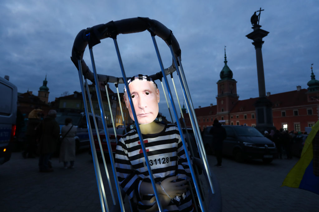 Activists in Poland depict Russian President Vladimir Putin in shackles (Jakub Porzycki/NurPhoto via Getty Images)