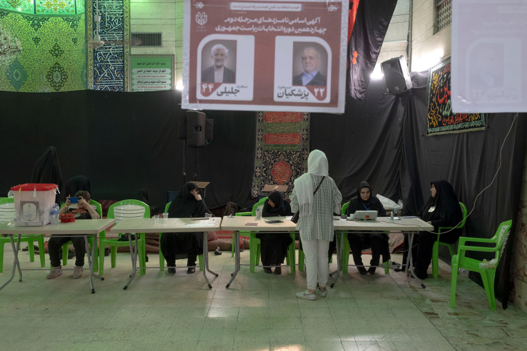 a polling station, before casting her ballot, during the second round of Iran's early Presidential elections, in central Tehran, Iran, on July 5, 2024.
