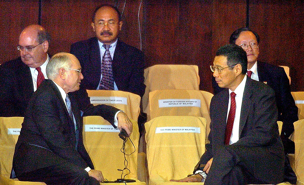 John Howard, left, as Australia's prime minister in 2004, talks with Singapore's Lee Hsien Loong as they attend the inauguration for Indonesia's Susilo Bambang Yudhoyono in Jakarta (Choo Youn-Kong/AFP via Getty Images)