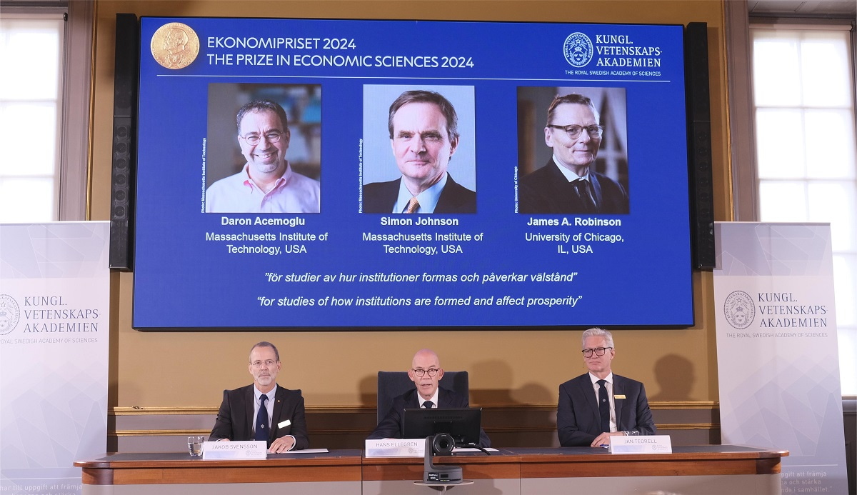 The 2024 Nobel Prize in Economics is announced in Stockholm, Sweden, Oct. 14, 2024. The Royal Swedish Academy of Sciences decided on Monday to award the 2024 Sveriges Riksbank Prize in Economic Sciences in Memory of Alfred Nobel to Daron Acemoglu, Simon Johnson and James A. Robinson.This trio, consisting of Daron Acemoglu and Simon Johnson, professors of the Massachusetts Institute of Technology, and James A. Robinson, professor of the University of Chicago, has been honored "for studies of how institutions are formed and affect prosperity." (Photo by Zhang Yuliang/Xinhua via Getty Images)