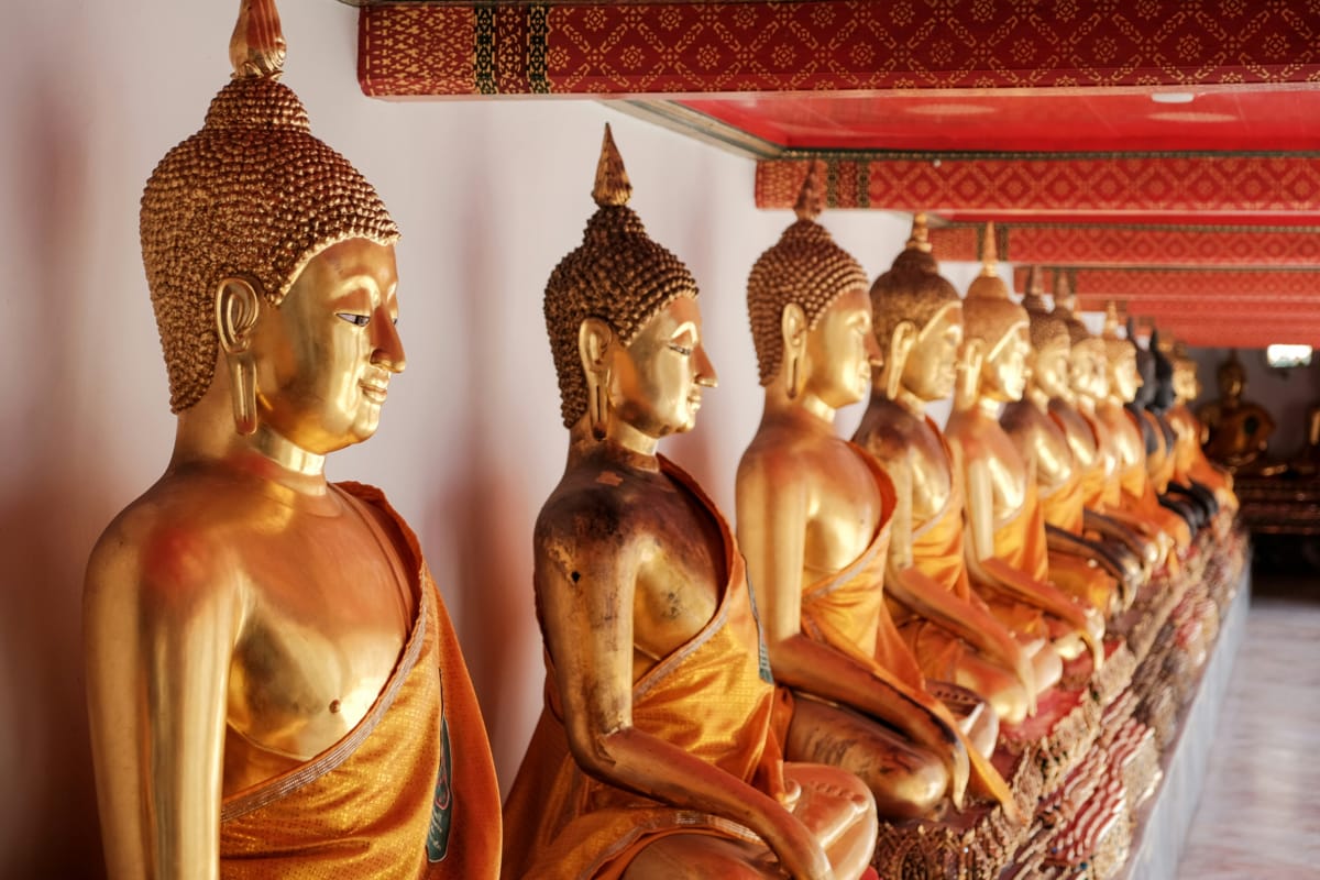 A line of golden statues at Wat Pho, Bangkok, Thailand (Jacob Guse/Unsplash)