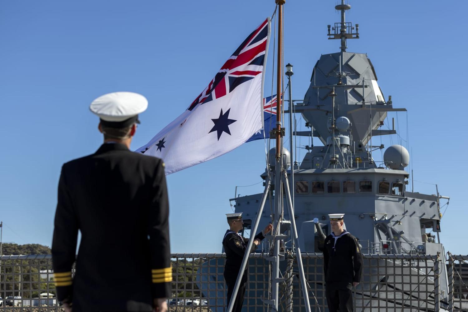 Lowering the Australian white ensign for the last time on HMAS Anzac during the decommissioning ceremony held at HMAS Stirling, Western Australia (Ernesto Sanchez/Defence Department)