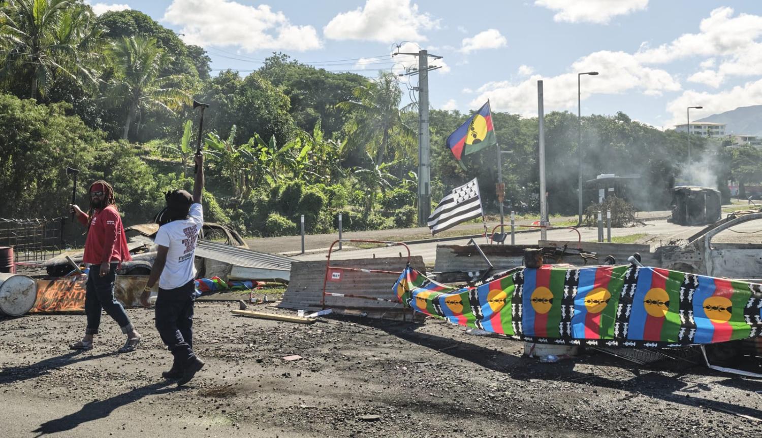 A roadblock barricade, with Kanak flags, controlling access to a district in Noumea, France's Pacific territory of New Caledonia, on 24 May (Theo Rouby/AFP via Getty Images)