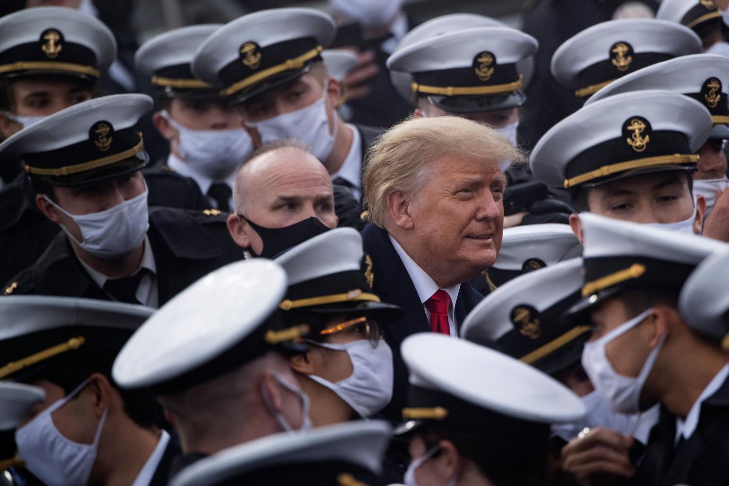 US President Donald Trump joins Naval Academy cadets during the Army-Navy football game at Michie Stadium on 12 December 2020 in West Point, New York. (Photo by Brendan Smialowski/AFP via Getty Images)