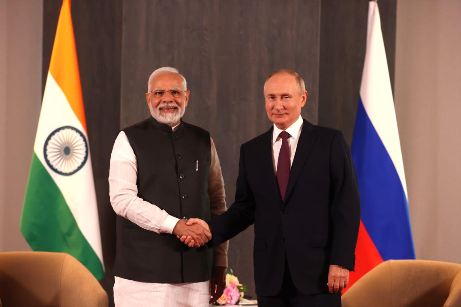 Grip, grin, and bear it: Narendra Modi and Vladimir Putin at the SCO summit in 2022 (MEA Photo Gallery/Flickr)