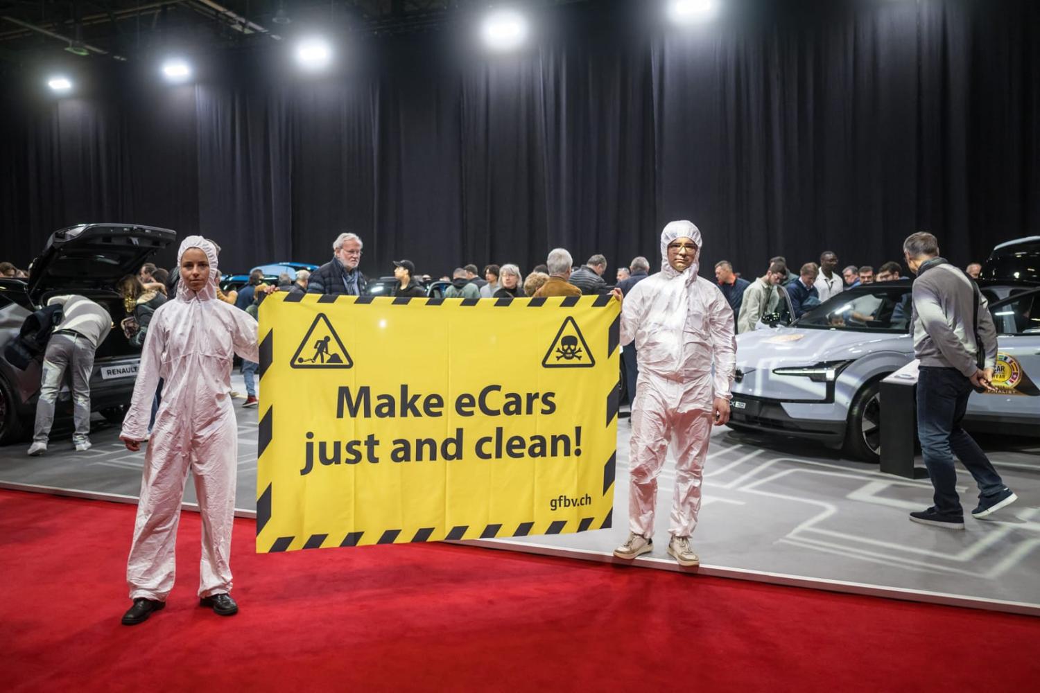 Activists at the Geneva International Motor Show in February calling for electric vehicle companies to commit to protecting human rights and the environment in the manufacturing of batteries (Fabrice Coffrini/AFP via Getty Images)