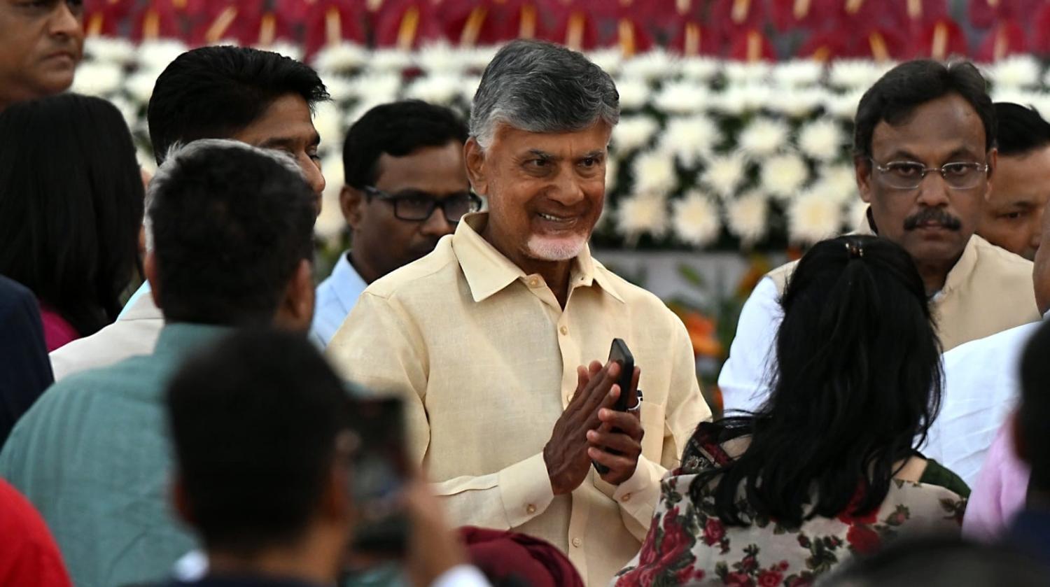 Chandrababu Naidu, leader of the Telugu Desam Party, centre, attends a swearing-in ceremony for Narendra Modi on 9 June (Prakash Singh/Bloomberg via Getty Images)
