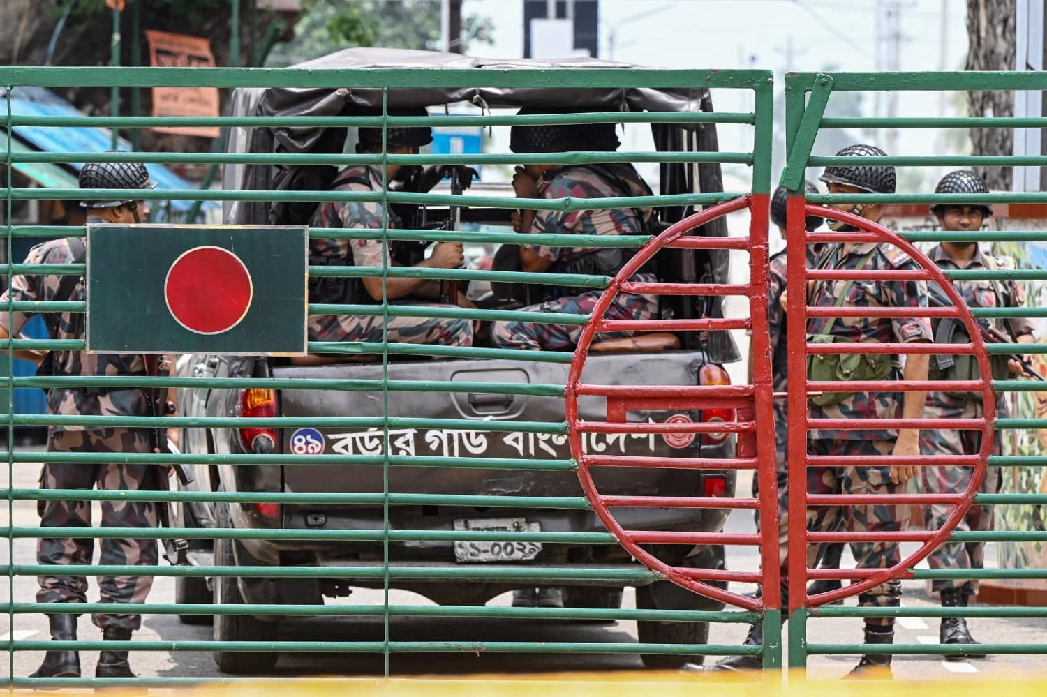 Border Guard Bangladesh personnel at the India-Bangladesh border of Petrapole, about 100km north-east of Kolkata on 6 August 2024 (Dibyangshu Sarkar/AFP via Getty Images)