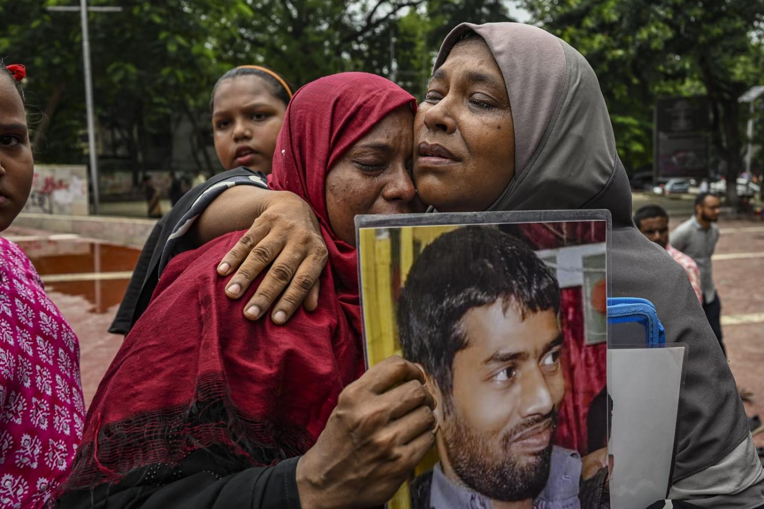 Family members of a relative of an enforced disappearance allegedly committed by government agencies during the years of Hasina rule (Zabed Hasnain Chowdhury/NurPhoto via Getty Images)