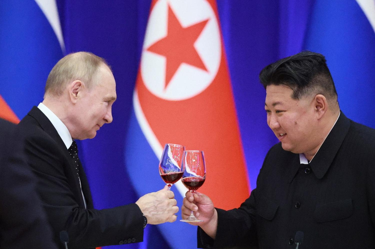 Russian President Vladimir Putin and North Korean leader Kim Jong-un toast during a reception in Pyongyang on 19 June 2024 (Vladimir Smirnov/AFP via Getty Images)