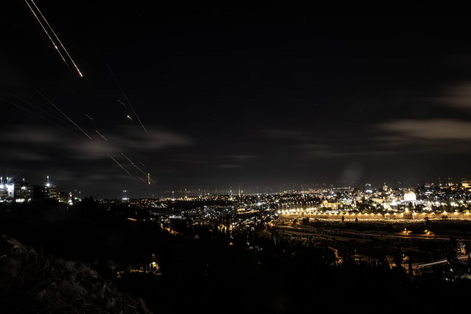 Rockets fired from Iran are seen over Jerusalem on 1 October 2024 (Mostafa Alkharouf/Anadolu via Getty Images)