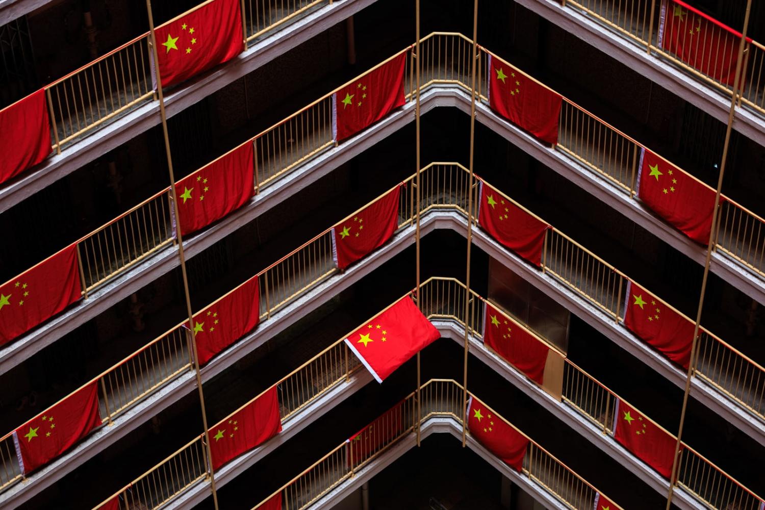 Chinese national flags are seen hanging at a public estate in Hong Kong, October 2024 (May James via Getty Images)