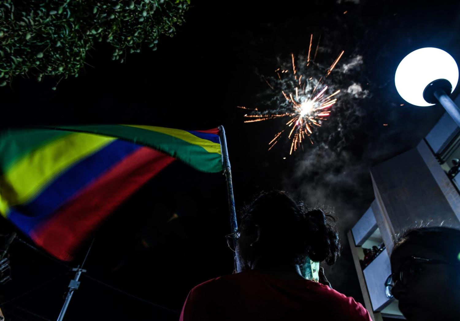 Supporters of the Alliance of Change celebrate in Triolet, Mauritius, after the announcement of election results (Li Yahui/Xinhua via Getty Images)