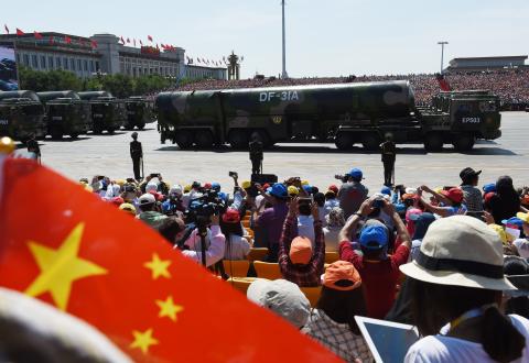 DF-31 intercontinental ballistic missile launch vehicles displayed in a military parade at Tiananmen Square, Beijing, on 3 September 2015. (Greg Baker/Getty)